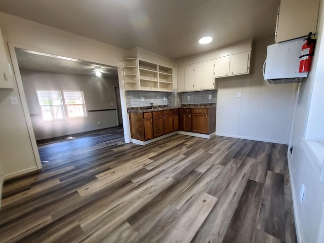105 N Washington St, Edgemont, SD 57735 - kitchen with dark countertops, open shelves, dark wood finished floors, and a ceiling fan