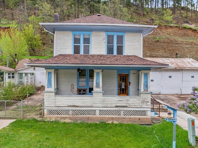 308 Main St, Deadwood, SD 57732 - view of front of house with a porch, a chimney, and roof with shingles