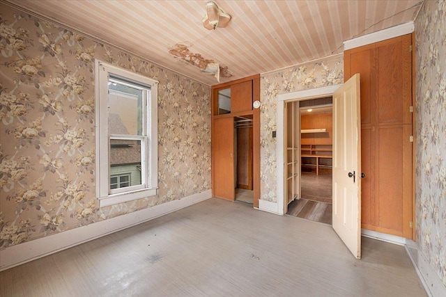 308 Main St, Deadwood, SD 57732 - empty room with wood finished floors, wood ceiling, baseboards, and crown molding