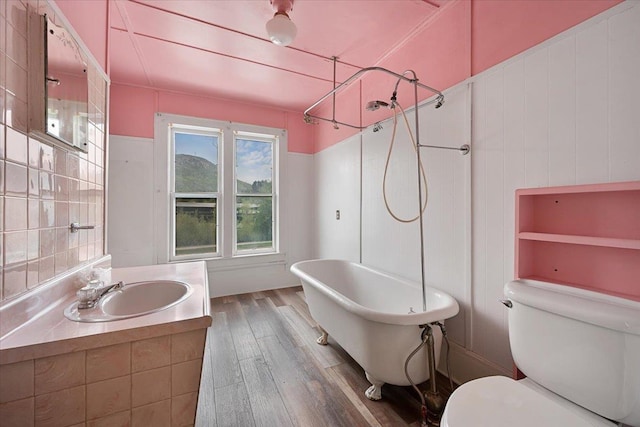 308 Main St, Deadwood, SD 57732 - full bath with wood finished floors, toilet, and vanity