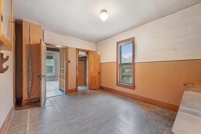 308 Main St, Deadwood, SD 57732 - spare room with wood finished floors and a wainscoted wall