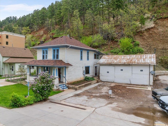 308 Main St, Deadwood, SD 57732 - view of front facade with a porch and an outbuilding