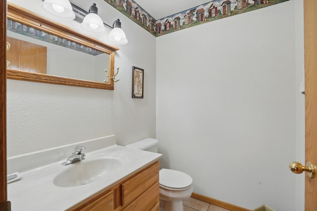 18977 Black Angus Ln, Belle Fourche, SD 57717 - bathroom featuring toilet, vanity, tile patterned floors, and baseboards