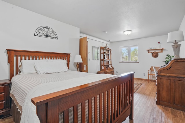 18977 Black Angus Ln, Belle Fourche, SD 57717 - bedroom with light wood-style flooring and baseboards