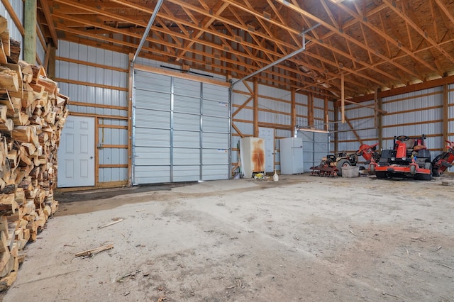18977 Black Angus Ln, Belle Fourche, SD 57717 - garage featuring freestanding refrigerator and metal wall