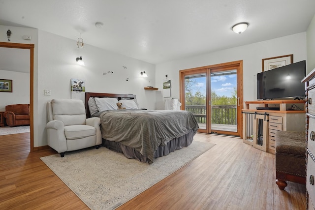 18977 Black Angus Ln, Belle Fourche, SD 57717 - bedroom with access to outside and wood finished floors