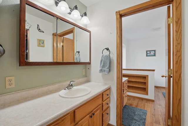 18977 Black Angus Ln, Belle Fourche, SD 57717 - bathroom featuring vanity and wood finished floors