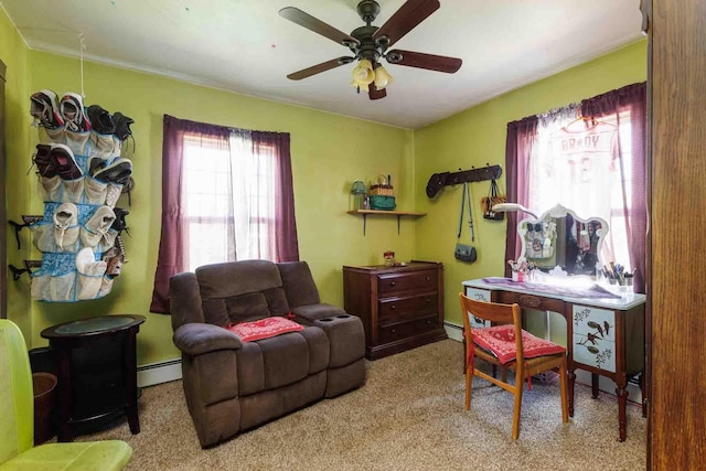 1007 Elkhorn St, Belle Fourche, SD 57717 - home office with carpet floors, a ceiling fan, and a baseboard radiator
