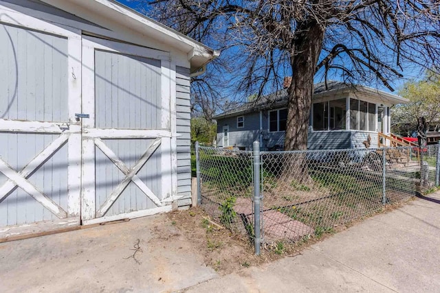 1007 Elkhorn St, Belle Fourche, SD 57717 - exterior space with an outbuilding, a storage shed, and a sunroom