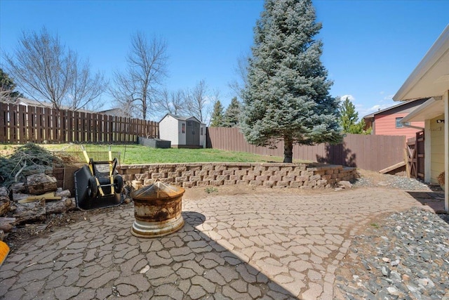 2921 1st Ave, Sturgis, SD 57785 - view of patio featuring a storage shed, an outbuilding, and an outdoor fire pit