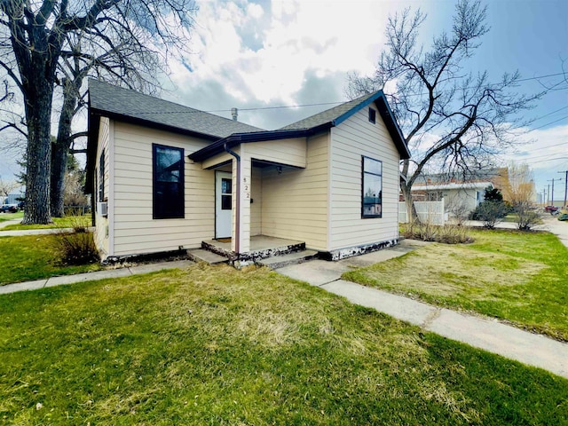 822 Harding St, Belle Fourche, SD 57717 - bungalow with a front yard and a shingled roof