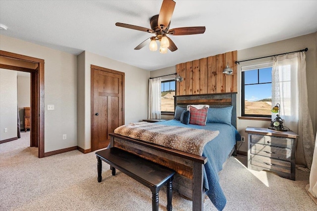 10226 Buena Vista Ln, Belle Fourche, SD 57717 - bedroom featuring light colored carpet, baseboards, ceiling fan, and a closet