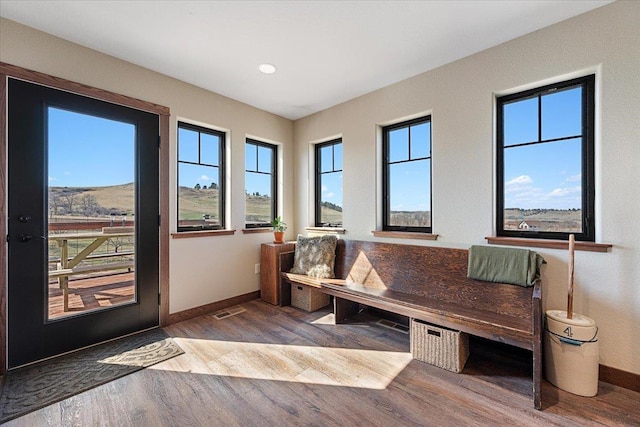 10226 Buena Vista Ln, Belle Fourche, SD 57717 - living area featuring baseboards, wood finished floors, and recessed lighting