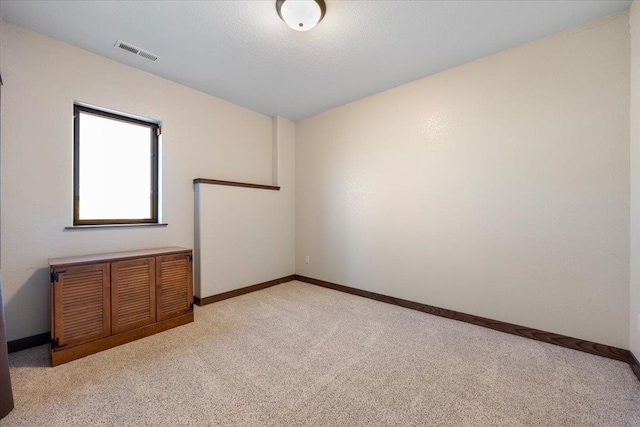 10226 Buena Vista Ln, Belle Fourche, SD 57717 - unfurnished room featuring light carpet and baseboards