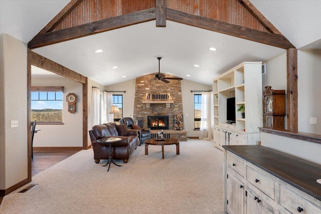 10226 Buena Vista Ln, Belle Fourche, SD 57717 - living room featuring carpet flooring, a ceiling fan, plenty of natural light, a stone fireplace, and recessed lighting