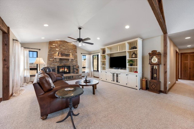 10226 Buena Vista Ln, Belle Fourche, SD 57717 - carpeted living room with vaulted ceiling, ceiling fan, a fireplace, recessed lighting, and baseboards