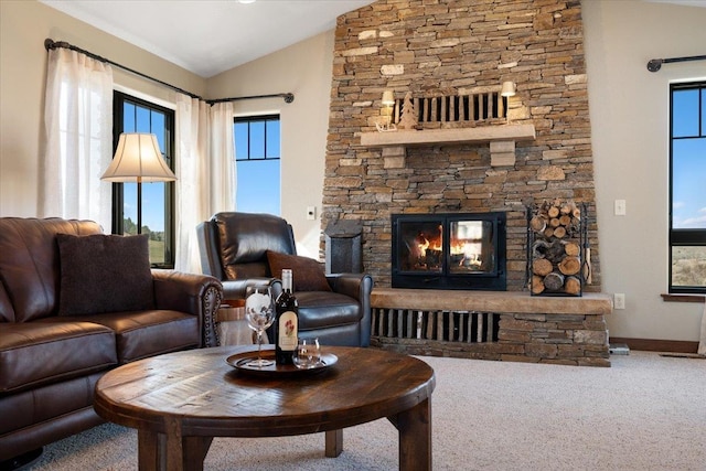 10226 Buena Vista Ln, Belle Fourche, SD 57717 - living area featuring vaulted ceiling, a stone fireplace, carpet, and baseboards