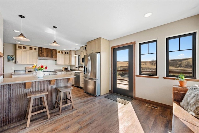 10226 Buena Vista Ln, Belle Fourche, SD 57717 - kitchen with stainless steel appliances, light countertops, recessed lighting, baseboards, and a sink