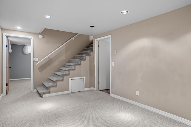 3520 Arizona St, Rapid City, SD 57701 - basement featuring carpet flooring, stairway, baseboards, and recessed lighting