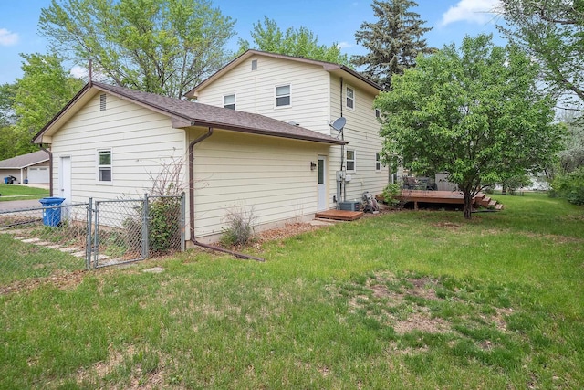 3520 Arizona St, Rapid City, SD 57701 - back of property with a deck, a shingled roof, and a gate
