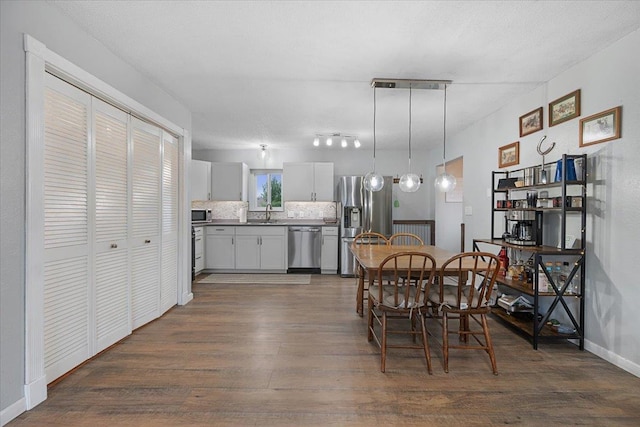 733 Zenith St, Belle Fourche, SD 57717 - dining space with dark wood-style floors and baseboards