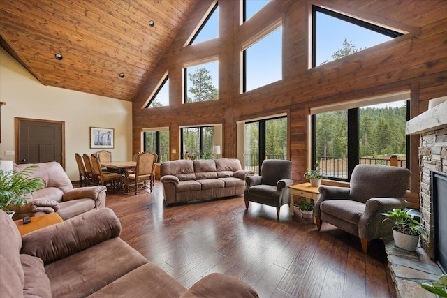 11132 Bogey Cir, Lead, SD 57754 - living room with high vaulted ceiling, a stone fireplace, wood-type flooring, and wooden ceiling