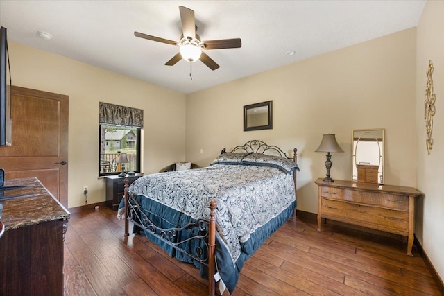 11132 Bogey Cir, Lead, SD 57754 - bedroom featuring wood-type flooring, baseboards, and a ceiling fan