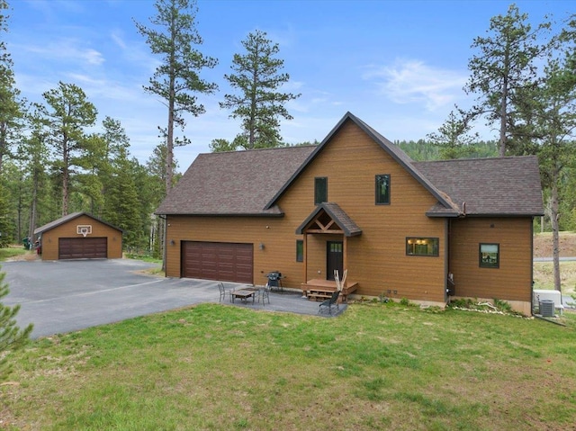 11132 Bogey Cir, Lead, SD 57754 - rustic home featuring a detached garage, a front yard, and a shingled roof