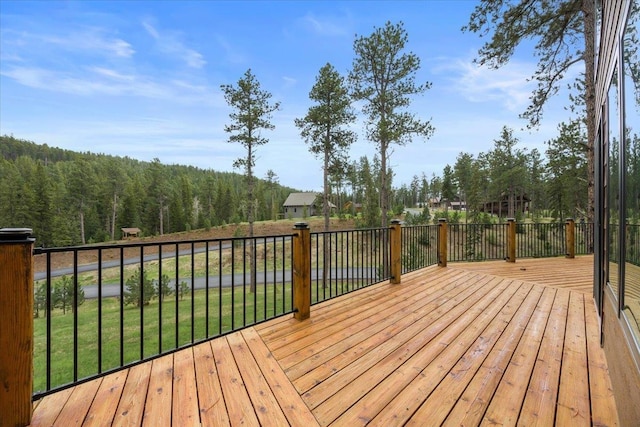 11132 Bogey Cir, Lead, SD 57754 - wooden deck with a forest view and a yard