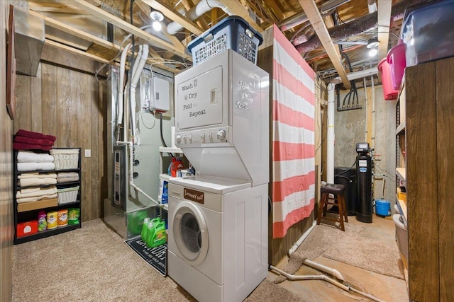 11132 Bogey Cir, Lead, SD 57754 - laundry room featuring stacked washer / drying machine and carpet flooring