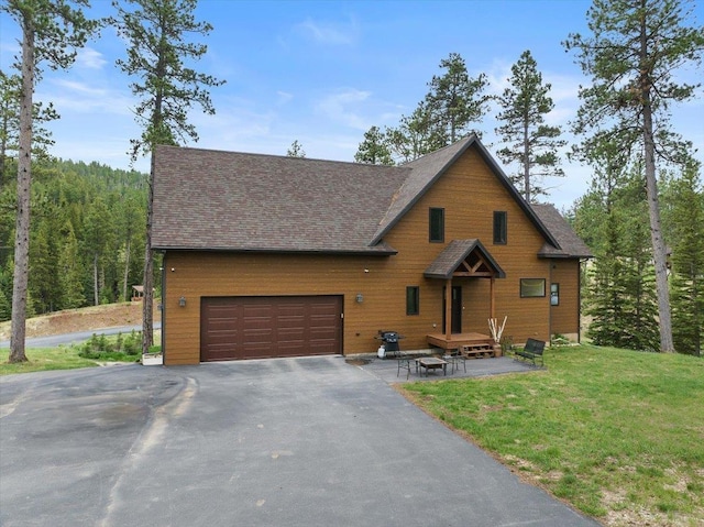 11132 Bogey Cir, Lead, SD 57754 - rustic home featuring driveway, a front yard, and roof with shingles
