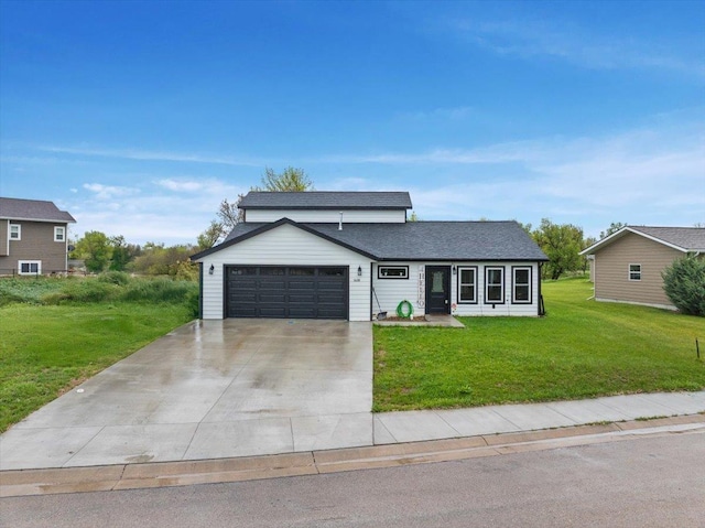 1430 Dacar St, Belle Fourche, SD 57717 - view of front facade with an attached garage, a front lawn, and concrete driveway