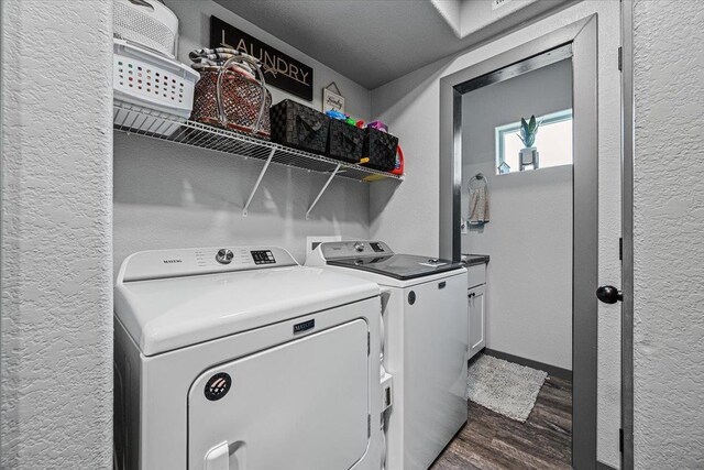 1430 Dacar St, Belle Fourche, SD 57717 - washroom featuring cabinet space, separate washer and dryer, dark wood-style flooring, a textured wall, and baseboards