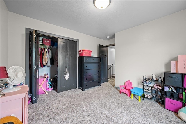 1430 Dacar St, Belle Fourche, SD 57717 - bedroom featuring carpet, a closet, and a textured ceiling