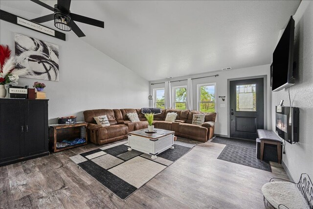 1430 Dacar St, Belle Fourche, SD 57717 - living area featuring wood finished floors, a ceiling fan, and vaulted ceiling