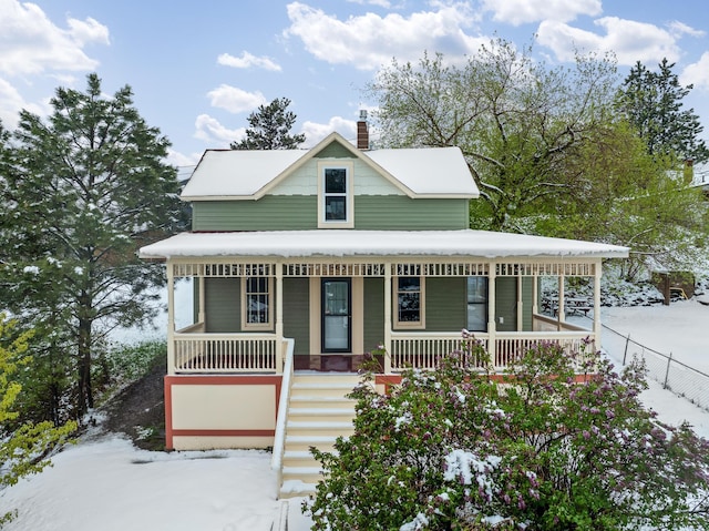 211 Milliken St, Lead, SD 57754 - view of front of property with covered porch, a chimney, and stairway