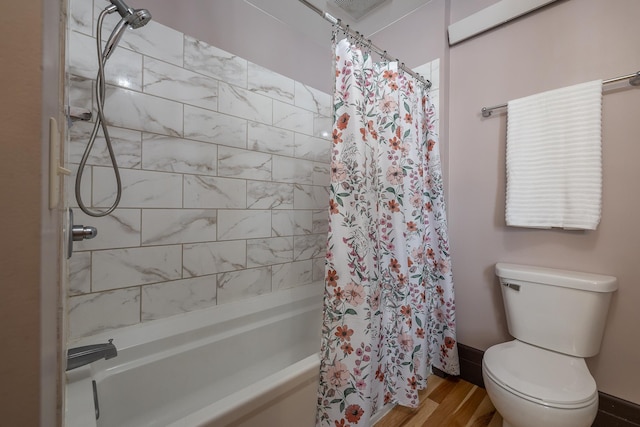 211 Milliken St, Lead, SD 57754 - bathroom featuring shower / tub combo, wood finished floors, and toilet