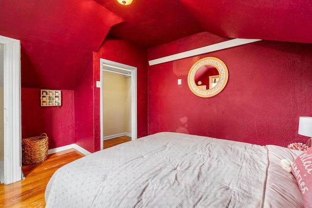 211 Milliken St, Lead, SD 57754 - bedroom featuring vaulted ceiling, wood finished floors, and baseboards