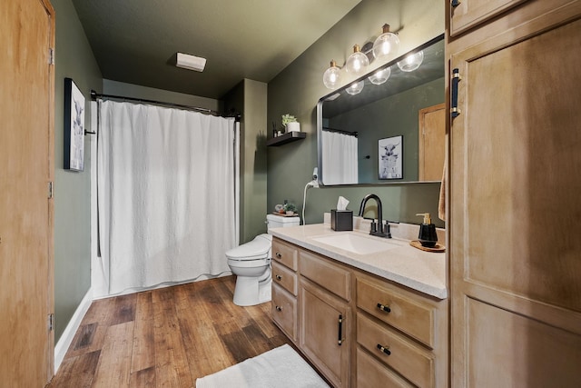 7350 Brighton St, Summerset, SD 57718 - bathroom with wood finished floors, toilet, vanity, a shower with shower curtain, and baseboards