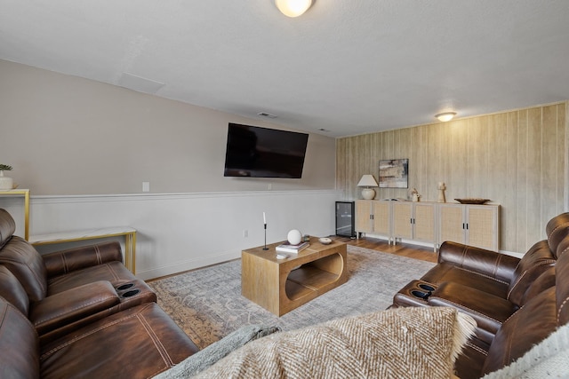7350 Brighton St, Summerset, SD 57718 - living room featuring wood finished floors, baseboards, and wooden walls