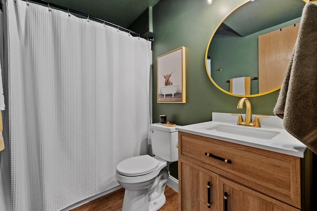 7350 Brighton St, Summerset, SD 57718 - full bathroom with wood finished floors, toilet, and vanity