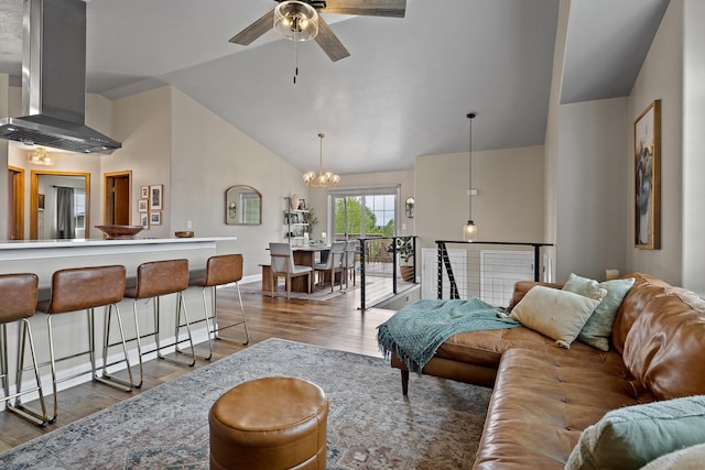 7350 Brighton St, Summerset, SD 57718 - living room with lofted ceiling, ceiling fan, wood finished floors, a chandelier, and baseboards