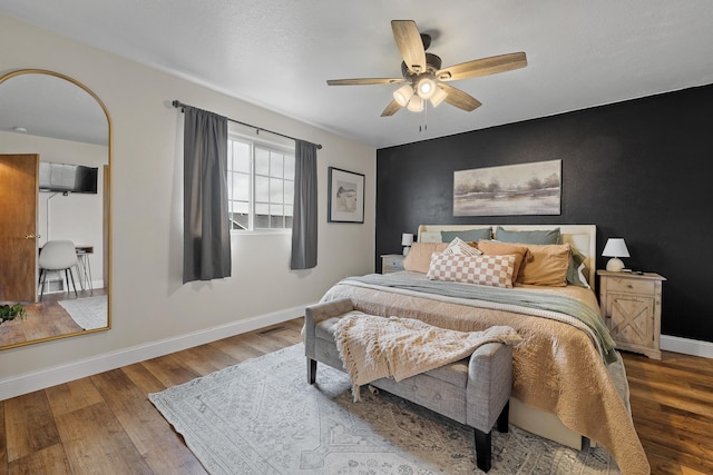 7350 Brighton St, Summerset, SD 57718 - bedroom with wood finished floors, baseboards, and ceiling fan