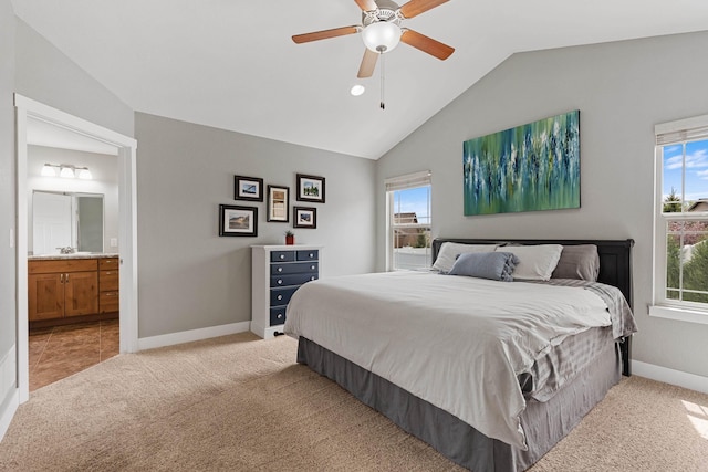 6212 Poppy Ct, Rapid City, SD 57702 - bedroom featuring lofted ceiling, light carpet, baseboards, connected bathroom, and a ceiling fan