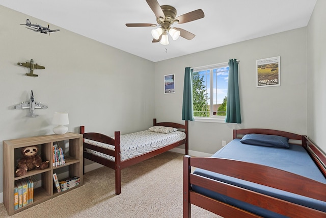 6212 Poppy Ct, Rapid City, SD 57702 - bedroom with carpet floors, baseboards, and a ceiling fan