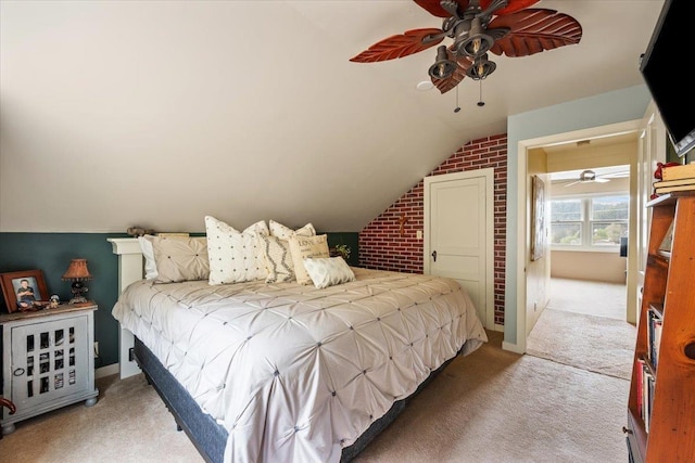 30 Adams St, Deadwood, SD 57732 - carpeted bedroom with lofted ceiling, brick wall, baseboards, and ceiling fan