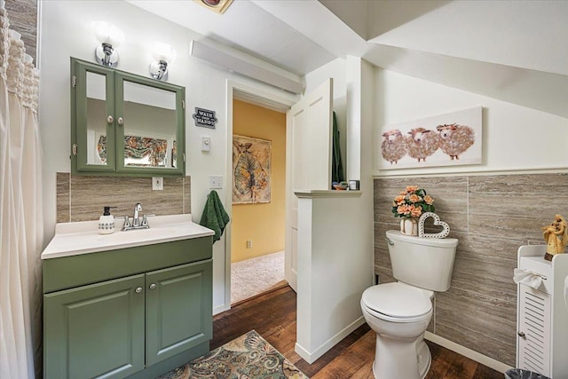 30 Adams St, Deadwood, SD 57732 - bathroom with vanity, wood finished floors, toilet, and tile walls
