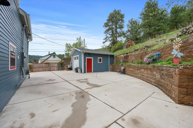 30 Adams St, Deadwood, SD 57732 - view of patio / terrace featuring an outbuilding and a detached garage