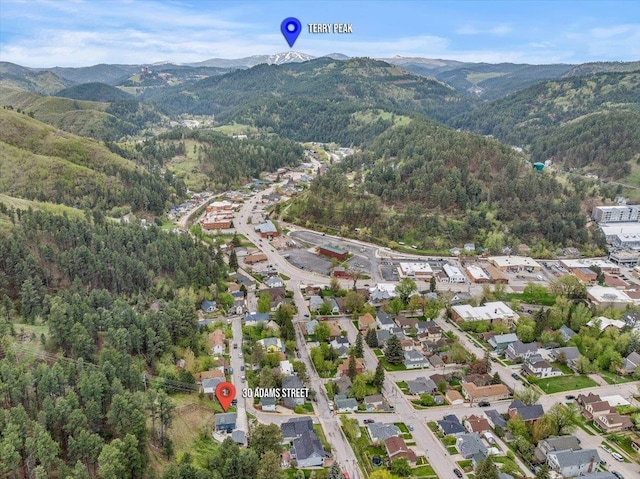 30 Adams St, Deadwood, SD 57732 - aerial view of property and surrounding area featuring a mountain backdrop and a forest
