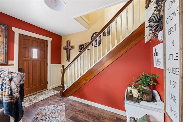 30 Adams St, Deadwood, SD 57732 - entrance foyer with stairs, a wainscoted wall, and wood finished floors